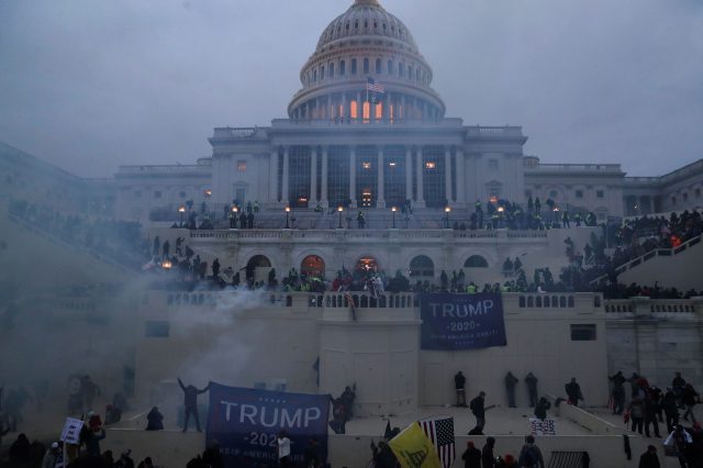 Photo of the US Capitol shrouded in smoke